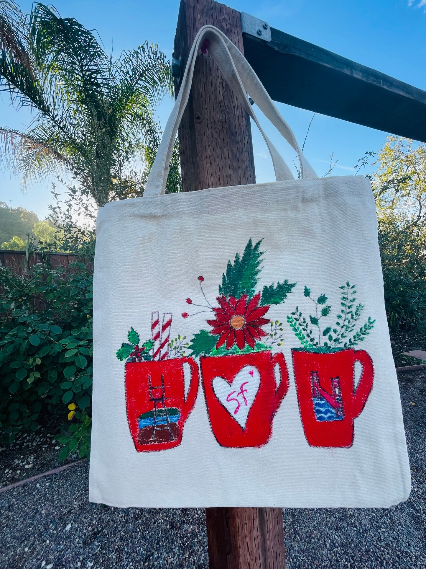 Tote-bag hand-painted San Francisco red coffee mugs with Golden Gate Bridge and Sutro Tower designs